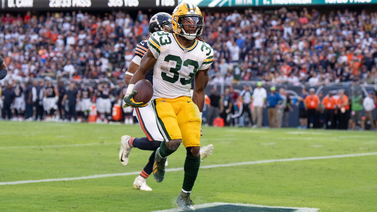 CHICAGO, IL - SEPTEMBER 10: Running back Aaron Jones #33 of the Green Bay Packers grabs his hamstring in play during an NFL football game against the Chicago Bear at Soldier Field on September 10, 2023 in Chicago, Illinois.