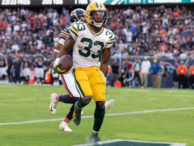 CHICAGO, IL - SEPTEMBER 10: Running back Aaron Jones #33 of the Green Bay Packers grabs his hamstring in play during an NFL football game against the Chicago Bear at Soldier Field on September 10, 2023 in Chicago, Illinois.
