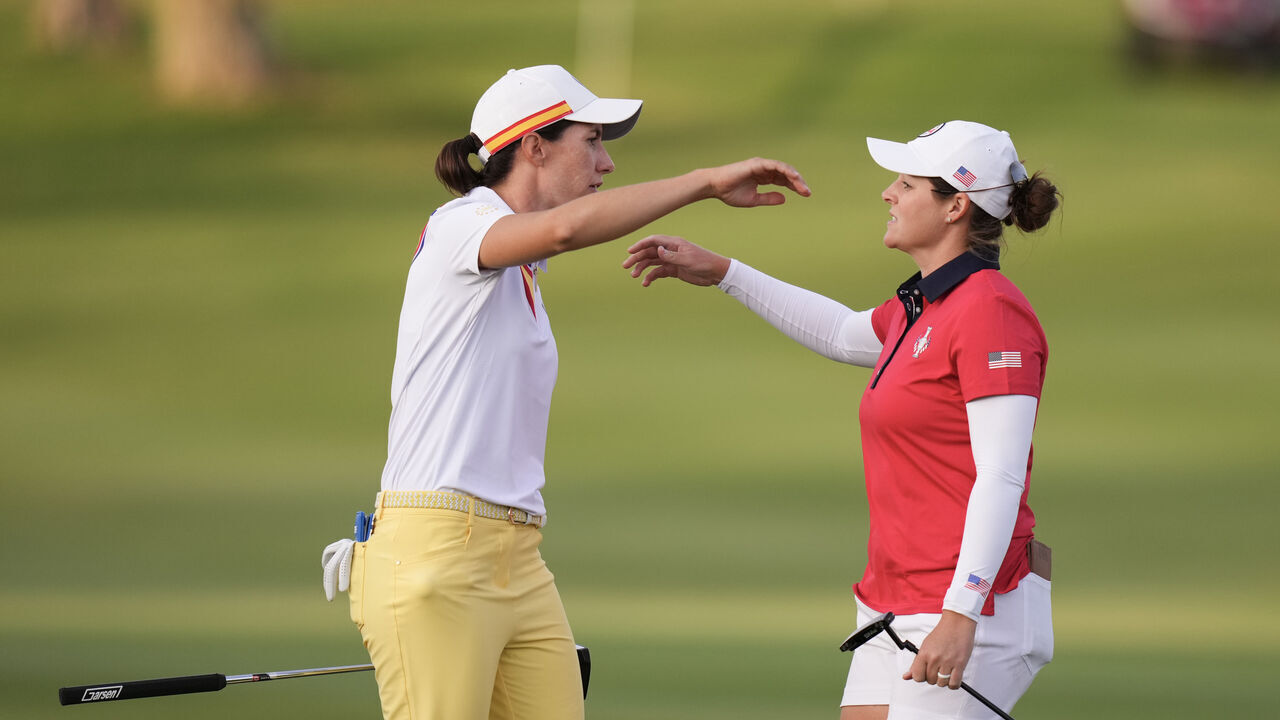 CASARES, SPAIN - SEPTEMBER 22: Carlota Ciganda of Team Europe hugs Ally Ewing of Team USA during Day One of The Solheim Cup at Finca Cortesin Golf Club on September 22, 2023 in Casares, Spain.
