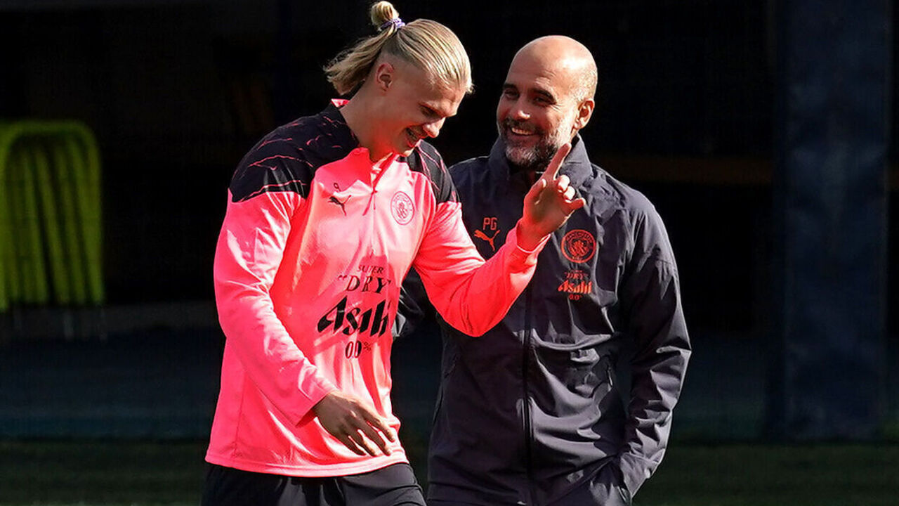Manchester City's Erling Haaland (left) and manager Pep Guardiola during a training session at City Football Academy, Manchester. Picture date: Monday September 18, 2023.