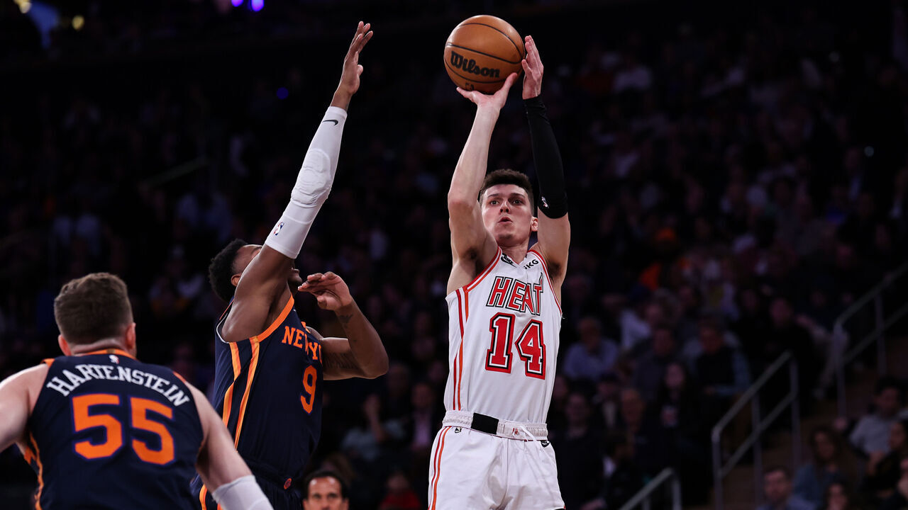 NEW YORK, NEW YORK - MARCH 29: Tyler Herro #14 of the Miami Heat shoots the ball guarded by RJ Barrett #9 of the New York Knicks during the second quarter of the game at Madison Square Garden on March 29, 2023 in New York City.