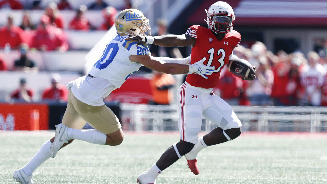 SALT LAKE CITY, UT - SEPTEMBER 23: Nate Johnson #13 of the Utah Utes is chased by Kain Medrano #20 of the UCLA Bruins during the first half of their game at Rice-Eccles Stadium September 23, 2023 in Salt Lake City, Utah.