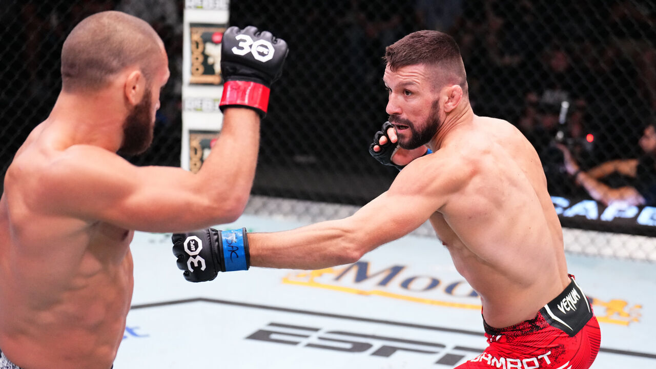 LAS VEGAS, NEVADA - SEPTEMBER 23: (R-L) Mateusz Gamrot of Poland battles Rafael Fiziev of Kazakstan in a lightweight fight during the UFC Fight Night event at UFC APEX on September 23, 2023 in Las Vegas, Nevada.
