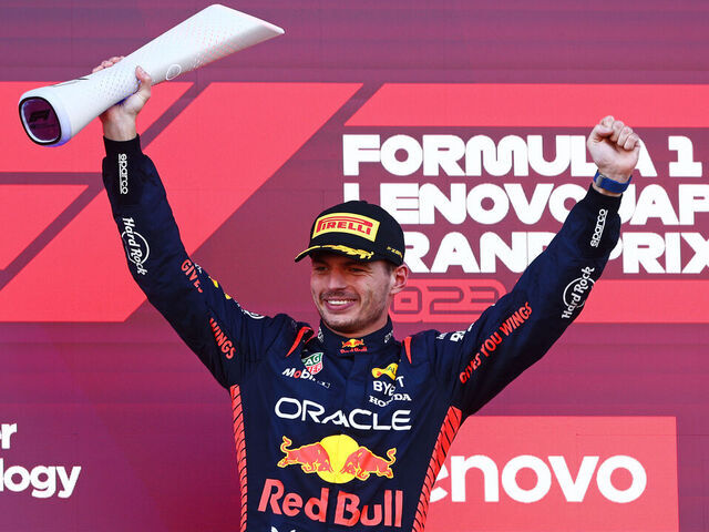 SUZUKA, JAPAN - SEPTEMBER 24: Race winner Max Verstappen of the Netherlands and Oracle Red Bull Racing celebrates on the podium during the F1 Grand Prix of Japan at Suzuka International Racing Course on September 24, 2023 in Suzuka, Japan.