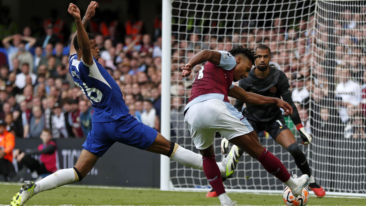 Aston Villa's English striker #11 Ollie Watkins (R) scores the opening goal of the English Premier League football match between Chelsea and Aston Villa at Stamford Bridge in London on September 24, 2023.