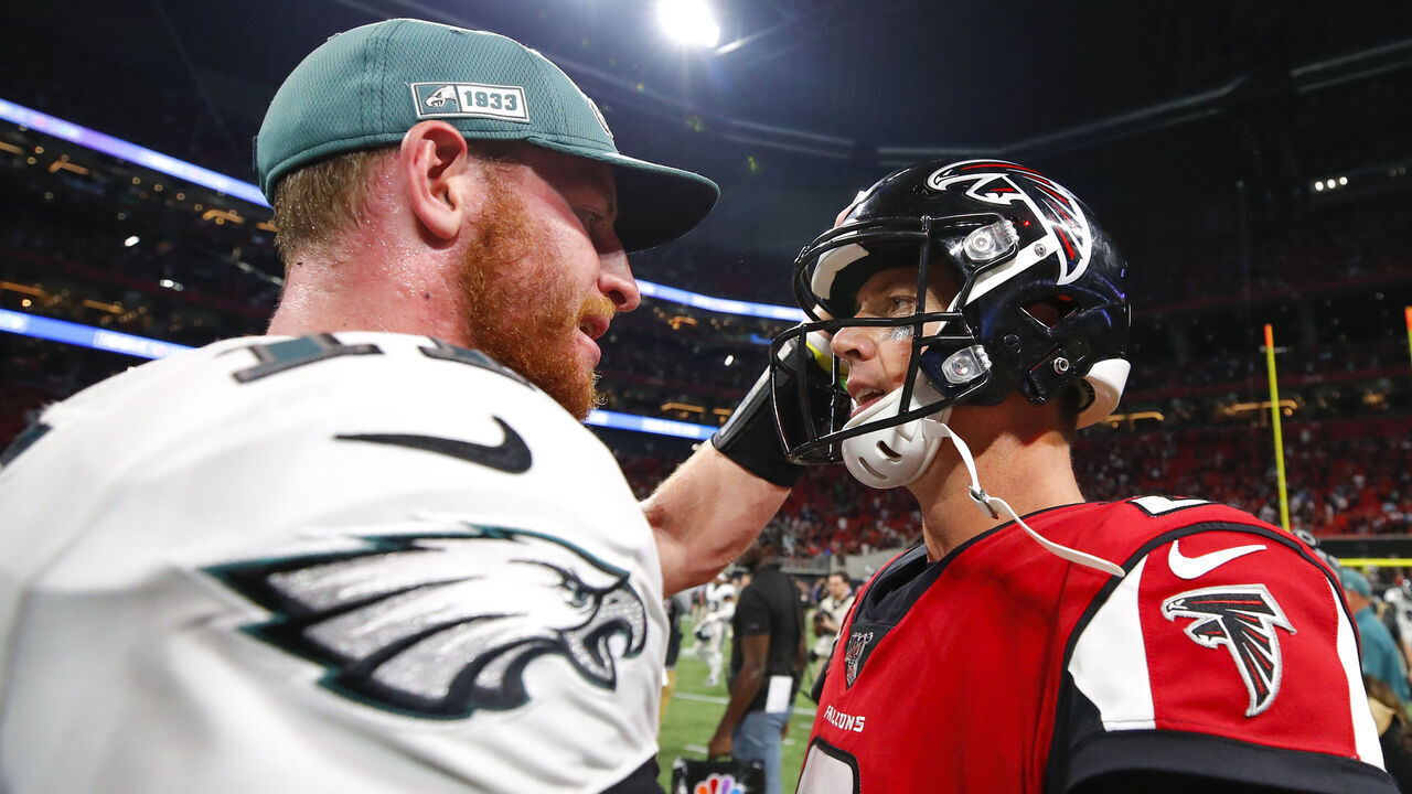 ATLANTA, GA - SEPTEMBER 15: Matt Ryan #2 of the Atlanta Falcons speaks with Carson Wentz #11 of the Philadelphia Eagles following an NFL game at Mercedes-Benz Stadium on September 15, 2019 in Atlanta, Georgia.