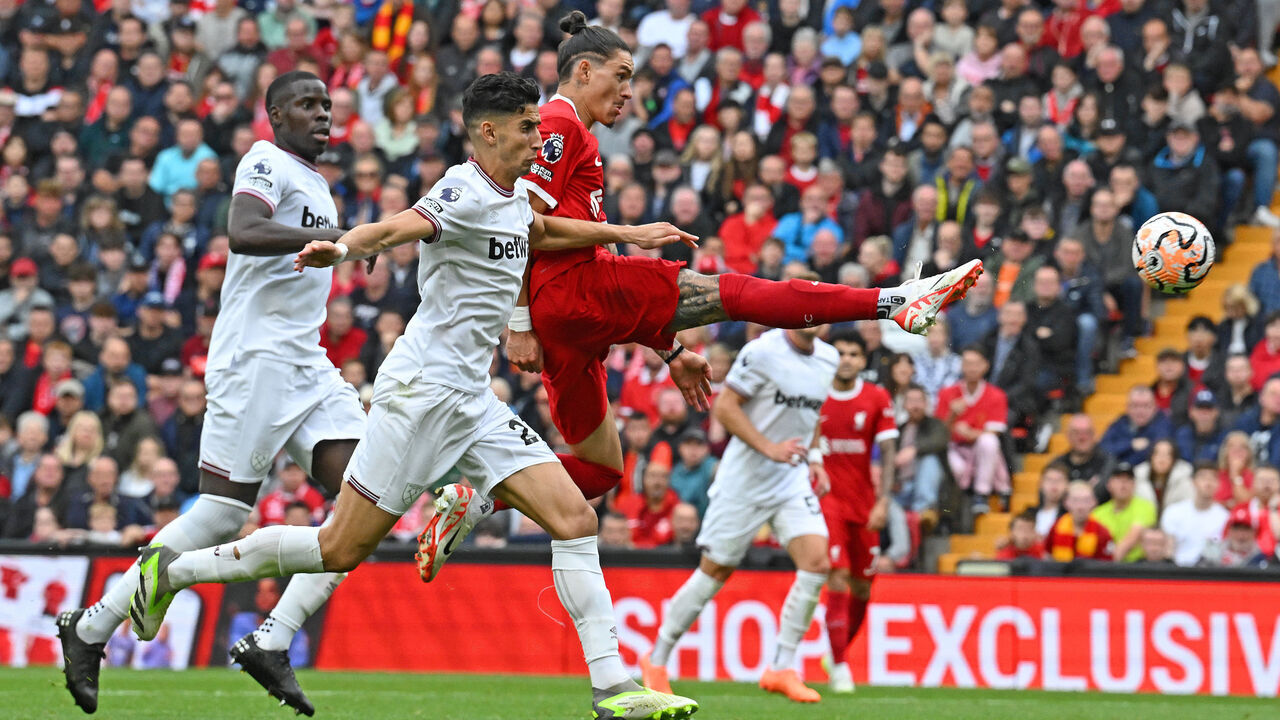 LIVERPOOL, ENGLAND - SEPTEMBER 24: (THE SUN OUT. THE SUN ON SUNDAY OUT) Darwin Nunez of Liverpool scores the second goal making the score 2-1 during the Premier League match between Liverpool FC and West Ham United at Anfield on September 24, 2023 in Liverpool, England.