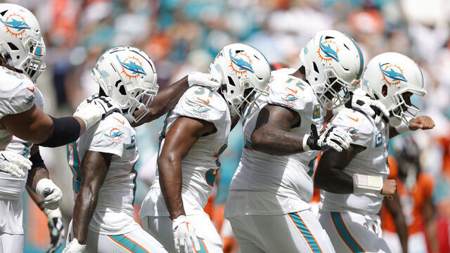 MIAMI GARDENS, FLORIDA - SEPTEMBER 24: Tyreek Hill #10 of the Miami Dolphins and Raheem Mostert #31 of the Miami Dolphins, Terron Armstead #72 of the Miami Dolphins, and Tua Tagovailoa #1 of the Miami Dolphins celebrate after Mostert's rushing touchdown during the second quarter against the Denver Broncos at Hard Rock Stadium on September 24, 2023 in Miami Gardens, Florida.