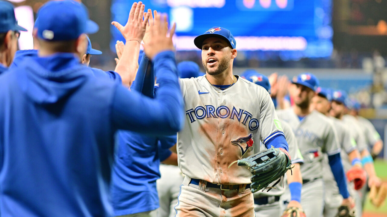 ST PETERSBURG, FLORIDA - SEPTEMBER 22: George Springer #4 of the Toronto Blue Jays celebrates with teammates after they defeated the Tampa Bay Rays 6-2 at Tropicana Field on September 22, 2023 in St Petersburg, Florida.
