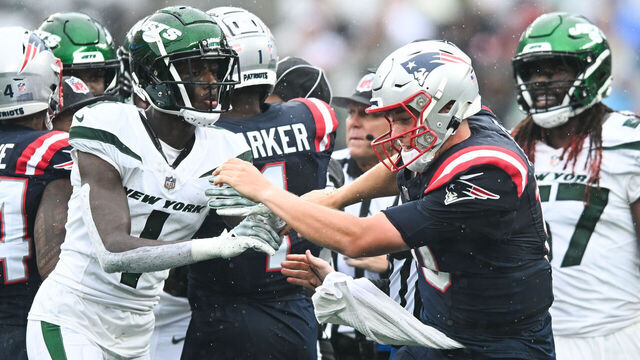 EAST RUTHERFORD, NJ - SEPTEMBER 24: Sauce Gardner #1 of the New York Jets pushes Mac Jones #10 of the New England Patriots during the second half at MetLife Stadium on September 24, 2023 in East Rutherford, New Jersey.