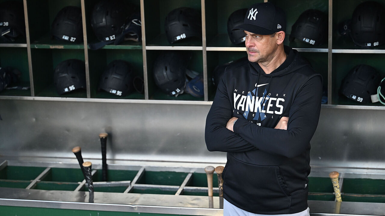 PITTSBURGH, PENNSYLVANIA - SEPTEMBER 16: Manager Aaron Boone #17 of the New York Yankees looks on from the dugout before the game against the Pittsburgh Pirates at PNC Park on September 16, 2023 in Pittsburgh, Pennsylvania.