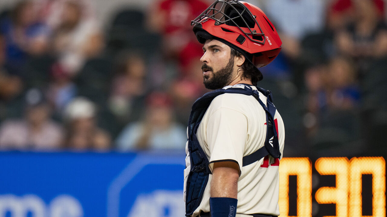 ARLINGTON, TX - SEPTEMBER 09: Austin Hedges #11 of the Texas Rangers looks on during a game against the Oakland Athletics at Globe Life Field on September 09, 2023 in Arlington, Texas.