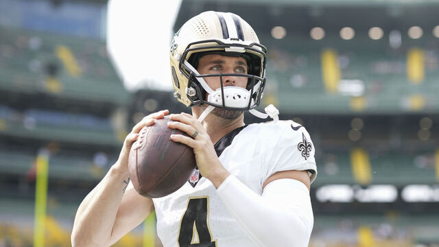 GREEN BAY, WI - SEPTEMBER 24: Quarterback Derek Carr #4 of the New Orleans Saints warms up prior to an NFL football game against the Green Bay Packers at Lambeau Field on September 29, 2023 in Green Bay, Wisconsin.