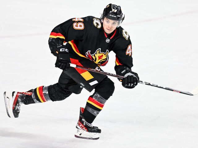 CALGARY, AB - FEBRUARY 28: Calgary Flames Left Wing Jakob Pelletier (49) skates during the first period of an NHL game between the Calgary Flames and the Boston Bruins on February 28, 2023, at the Scotiabank Saddledome in Calgary, AB.
