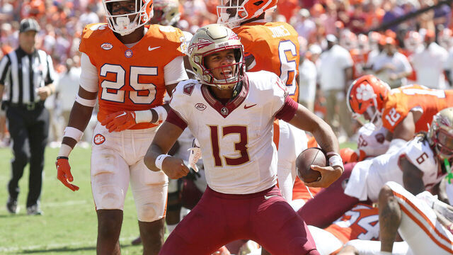 CLEMSON, SC - SEPTEMBER 23: Florida State Seminoles quarterback Jordan Travis (13) celebrates after scoring a touchdown during a college football game between the Florida State Seminoles and the Clemson Tigers on September 23, 2023, at Clemson Memorial Stadium in Clemson, S.C.