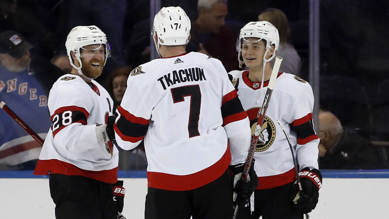 NEW YORK, NEW YORK - DECEMBER 02: Brady Tkachuk #7 of the Ottawa Senators celebrates with teammates Claude Giroux #28 and Tim Stutzle #18 after scoring the overtime game-winning goal against the New York Rangers at Madison Square Garden on December 02, 2022 in New York City.