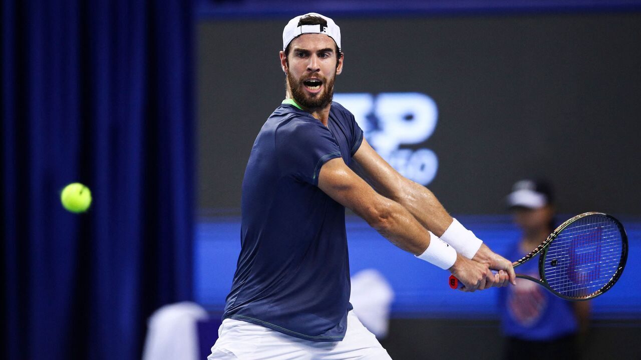 Karen Khachanov of Russia hits a return against Yoshihito Nishioka of Japan during their men's singles final match at the Zhuhai Championships tennis tournament in Zhuhai, in China's southern Guangdong province on September 26, 2023.