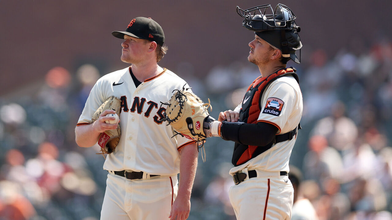 SAN FRANCISCO, CALIFORNIA - AUGUST 30: Patrick Bailey #14 comes out to speak to Logan Webb #62 of the San Francisco Giants after the Cincinnati Reds scored two runs in the sixth inning at Oracle Park on August 30, 2023 in San Francisco, California.