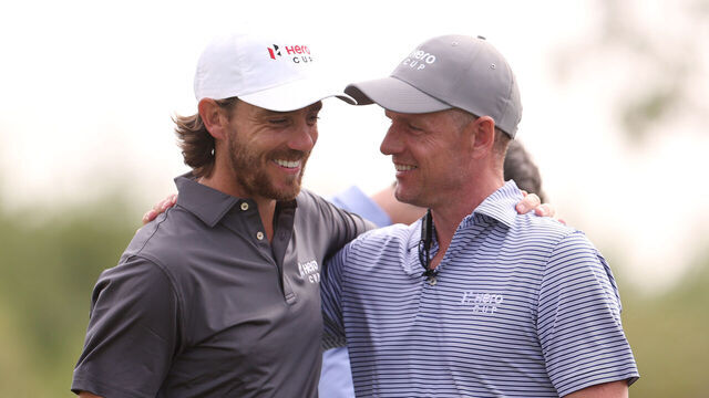 ABU DHABI, UNITED ARAB EMIRATES - JANUARY 15: Tommy Fleetwood, Captain of Great Britain & Ireland and Luke Donald, European Ryder Cup Captain react on Day Three of the Hero Cup at Abu Dhabi Golf Club on January 15, 2023 in Abu Dhabi, United Arab Emirates.