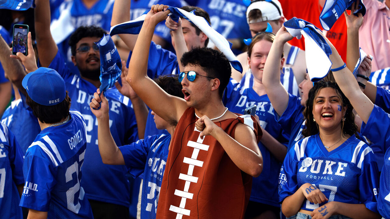 DURHAM, NORTH CAROLINA - SEPTEMBER 04: Fans of the Duke Blue Devils cheer during the game against the Clemson Tigers at Wallace Wade Stadium on September 4, 2023 in Durham, North Carolina. Duke won 28-7.