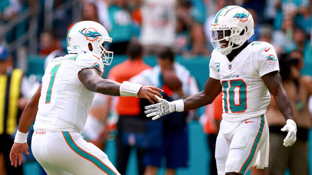 MIAMI GARDENS, FLORIDA - SEPTEMBER 24: Tua Tagovailoa #1 of the Miami Dolphins and Tyreek Hill #10 of the Miami Dolphins celebrate after a Miami touchdown during the third quarter against the Denver Broncos at Hard Rock Stadium on September 24, 2023 in Miami Gardens, Florida.