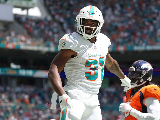 MIAMI GARDENS, FL - SEPTEMBER 24: Miami Dolphins running back Raheem Mostert (31) leaps in celebration after a touchdown during the game between the Denver Broncos and the Miami Dolphins on Sunday, September 24, 2023 at Hard Rock Stadium, Miami, Fla.