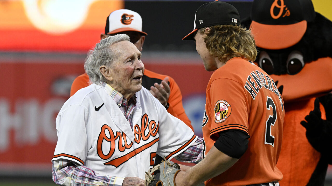 BALTIMORE, MARYLAND - SEPTEMBER 24: Former Baltimore Orioles and Hall of Famer Brooks Robinson talks with Gunnar Henderson #2 of the Baltimore Orioles before the game between the Baltimore Orioles and the Houston Astros at Oriole Park at Camden Yards on September 24, 2022 in Baltimore, Maryland.