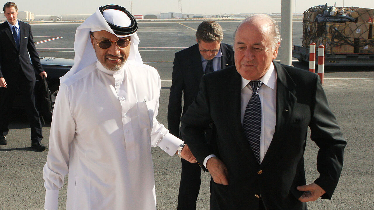 FIFA president Joseph Blatter (R) is greeted by AFC president Mohammed bin Hammam upon his arrival at the airport in Doha for an official visit to Qatar on December 16, 2010. Qatar is hosting the 2022 World Cup football tournament. AFP PHOTO/STR