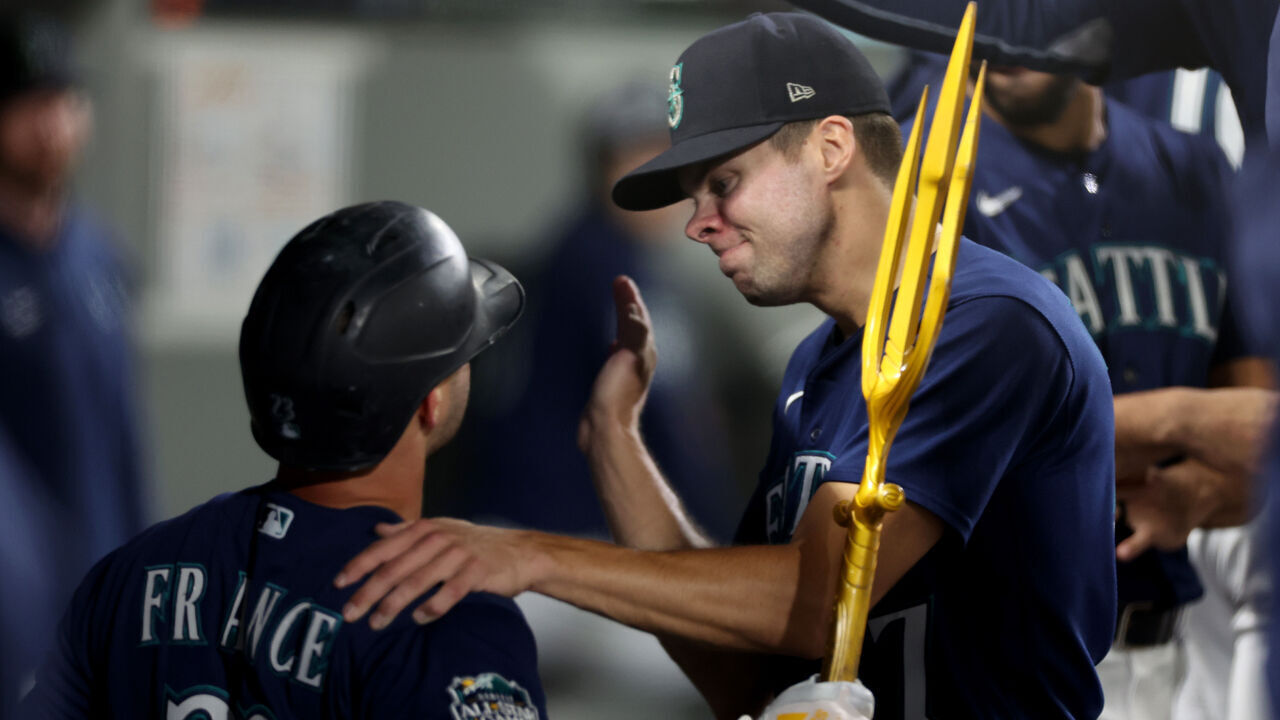 SEATTLE, WASHINGTON - SEPTEMBER 26: Ty France #23 of the Seattle Mariners celebrates his solo home run with Matt Brash #47during the eighth inning against the Houston Astros at T-Mobile Park on September 26, 2023 in Seattle, Washington.
