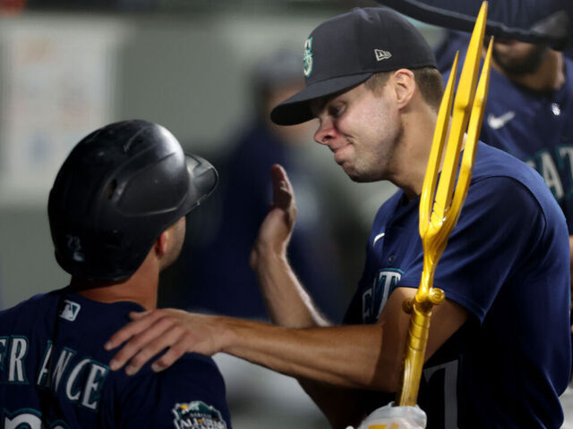 SEATTLE, WASHINGTON - SEPTEMBER 26: Ty France #23 of the Seattle Mariners celebrates his solo home run with Matt Brash #47during the eighth inning against the Houston Astros at T-Mobile Park on September 26, 2023 in Seattle, Washington.