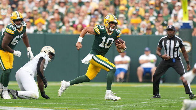 GREEN BAY, WI - SEPTEMBER 24: Jordan Love #10 of the Green Bay Packers runs the ball during the first half of an NFL football game against the New Orleans Saints at Lambeau Field on September 24, 2023 in Green Bay, Wisconsin.