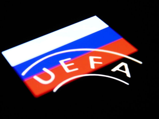 UEFA logo displayed on a phone screen and Russian flag displayed on a phone screen are seen in this multiple exposure illustration photo taken in Krakow, Poland on February 28, 2022. (Photo illustration by Jakub Porzycki/NurPhoto via Getty Images)