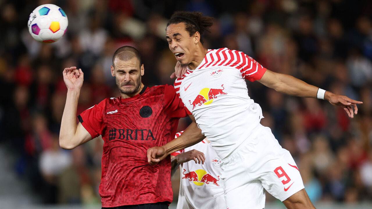 WIESBADEN, GERMANY - SEPTEMBER 27: Aleksandar Vukotic of SV Wehen Wiesbaden jumps for the ball with Yussuf Poulsen of RB Leipzig during the DFB cup first round match between SV Wehen Wiesbaden and RB Leipzig at BRITA-Arena on September 27, 2023 in Wiesbaden, Germany.