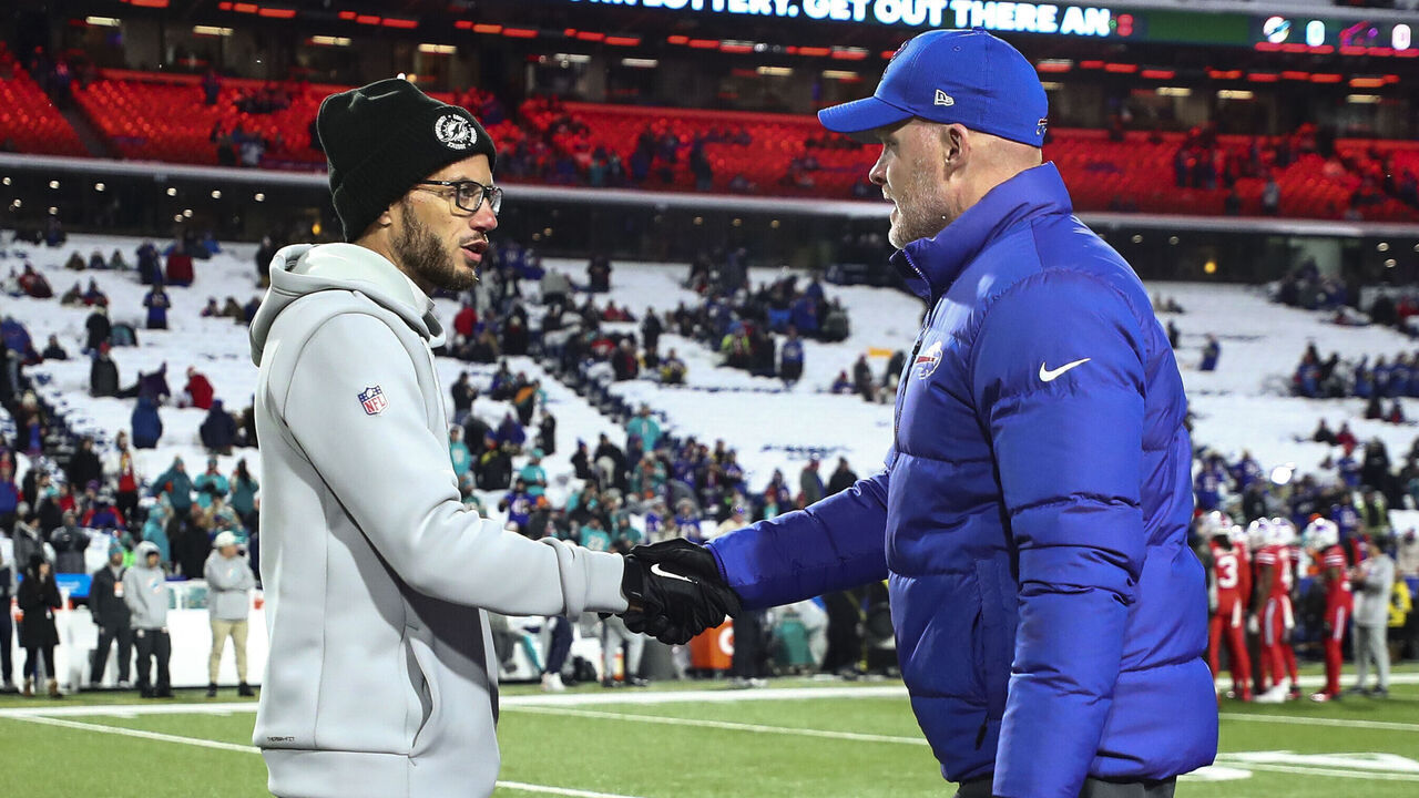 ORCHARD PARK, NY - DECEMBER 17: Head coach Mike McDaniel of the Miami Dolphins shakes hands with head coach Sean McDermott of the Buffalo Bills prior to an NFL football game at Highmark Stadium on December 17, 2022 in Orchard Park, New York.