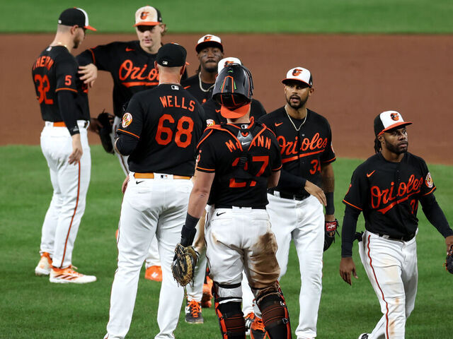BALTIMORE, MARYLAND - SEPTEMBER 27: Members of the Baltimore Orioles celebrate their 5-1 win over the Washington Nationals at Oriole Park at Camden Yards on September 27, 2023 in Baltimore, Maryland.