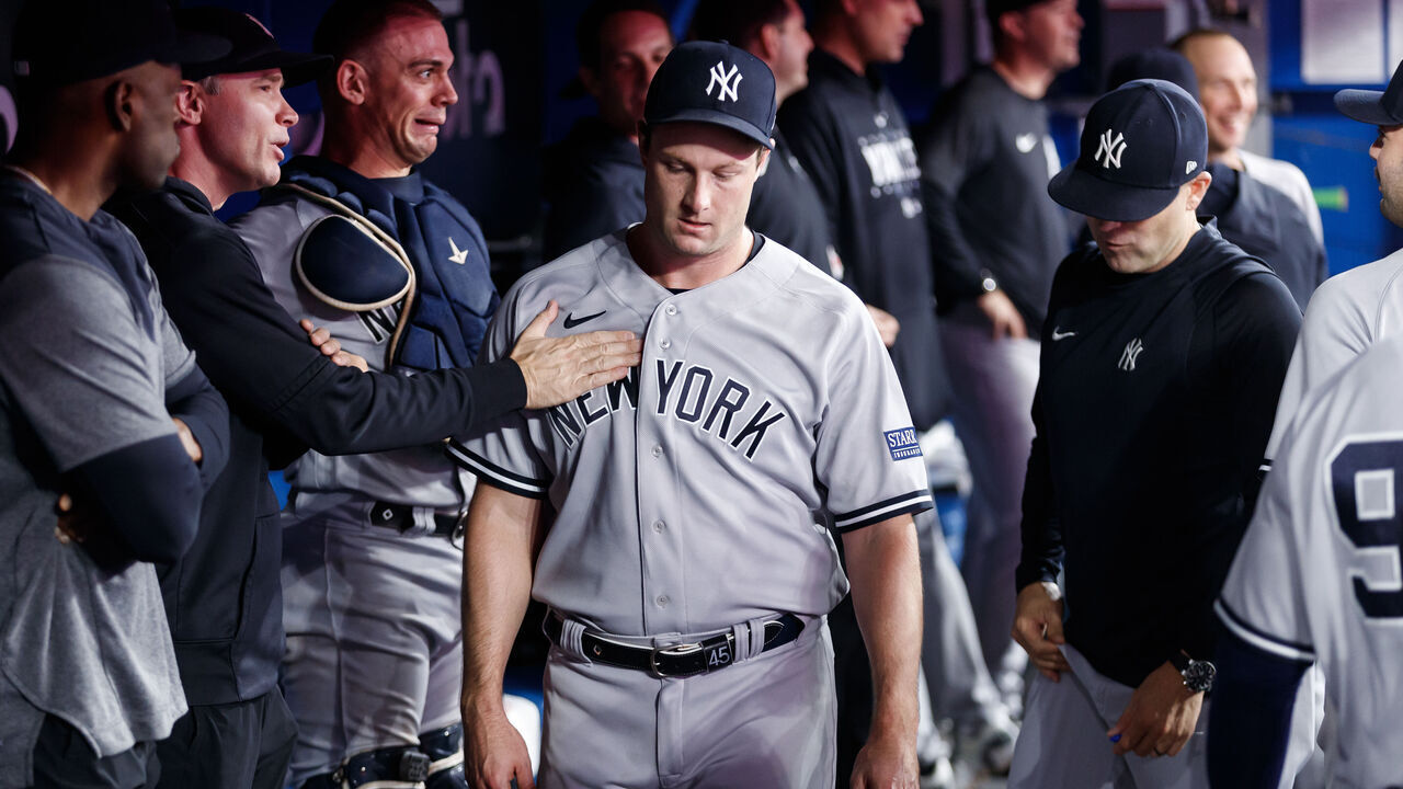 TORONTO, CANADA - SEPTEMBER 27: Gerrit Cole #45 of the New York Yankees walks through the dugout after the top of the seventh inning of their MLB game against the Toronto Blue Jays at Rogers Centre on September 27, 2023 in Toronto, Canada.