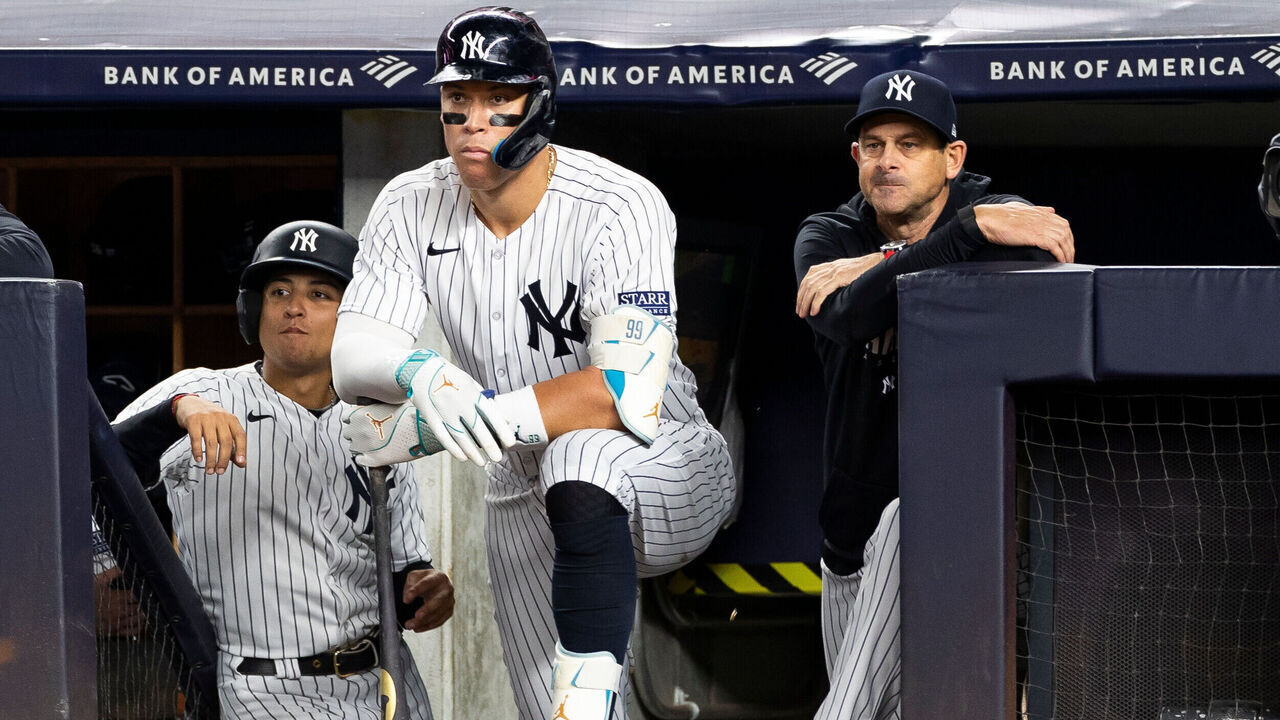BRONX, NY - SEPTEMBER 22: New York Yankees right fielder Aaron Judge (99) and manager Aaron Boone (17) stand in the dugout during the fifth inning of a regular season game between the Arizona Diamondbacks and New York Yankees on September 22, 2023 at Yankee Stadium in the Bronx, New York.