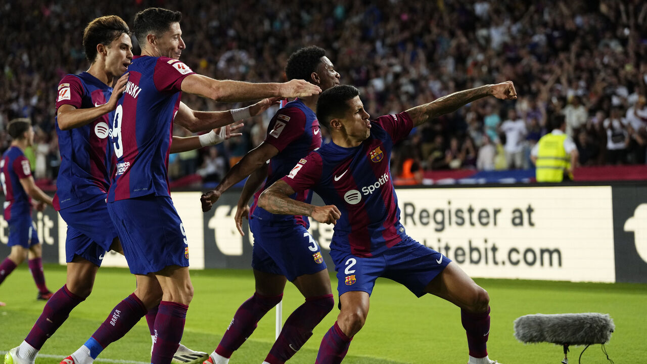 Joao Cancelo right-back of Barcelona and Portugal celebrates after scoring his sides first goal during the LaLiga EA Sports match between FC Barcelona and Celta Vigo at Estadi Olimpic Lluis Companys on September 23, 2023 in Barcelona, Spain.