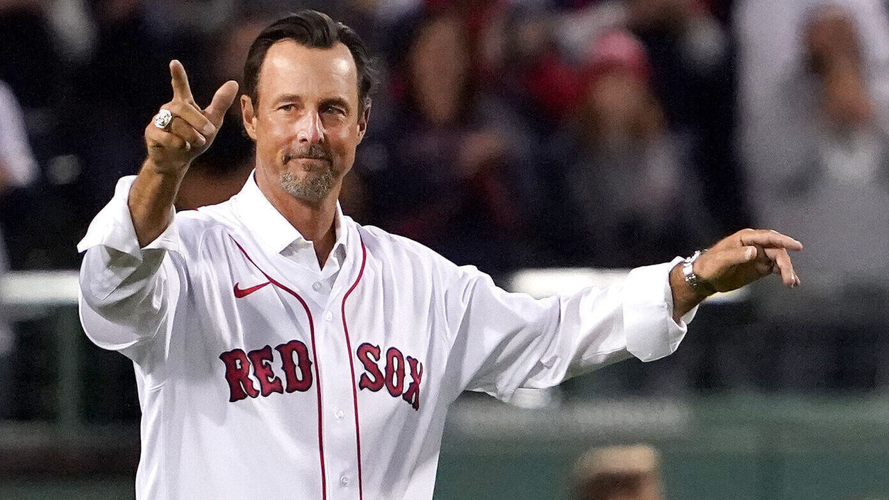 Boston - October 19: Former Red Sox pitcher Tim Wakefield on the field before throwing out the ceremonial pitch. The Boston Red Sox host the Houston Astros in Game 4 of the ALCS at Fenway Park in Boston on Oct. 19, 2021.