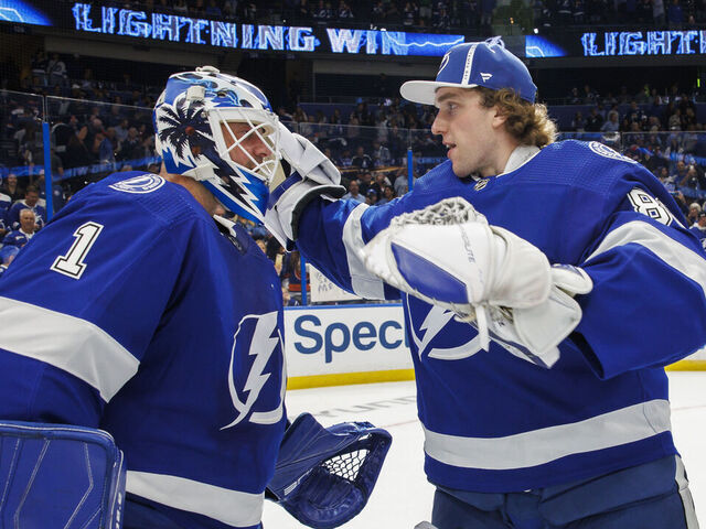 TAMPA, FL - OCTOBER 22: Goalies Brian Elliott #1 and Andrei Vasilevskiy #88 of the Tampa Bay Lightning celebrate the win against the New York Islanders at Amalie Arena on October 22, 2022 in Tampa, Florida.