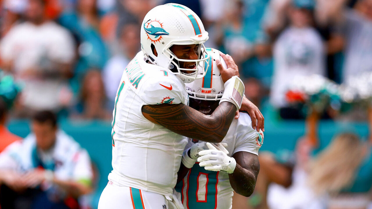 MIAMI GARDENS, FLORIDA - SEPTEMBER 24: Tua Tagovailoa #1 of the Miami Dolphins and Tyreek Hill #10 of the Miami Dolphins celebrate after a Miami touchdown during the third quarter against the Denver Broncos at Hard Rock Stadium on September 24, 2023 in Miami Gardens, Florida.