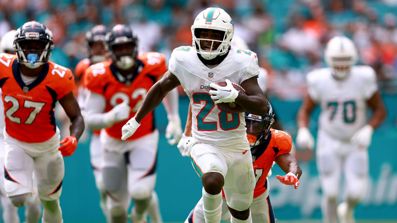 MIAMI GARDENS, FLORIDA - SEPTEMBER 24: De'Von Achane #28 of the Miami Dolphins rushes for a touchdown against the Denver Broncos during the fourth quarter at Hard Rock Stadium on September 24, 2023 in Miami Gardens, Florida.
