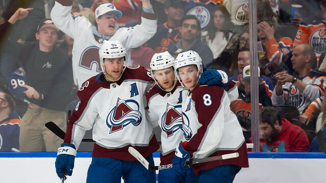 EDMONTON, AB - APRIL 09: Mikko Rantanen #96, Nathan MacKinnon #29 and Cale Makar #8 of the Colorado Avalanche celebrate a goal against the Edmonton Oilers during the third period at Rogers Place on April 9, 2022 in Edmonton, Canada.