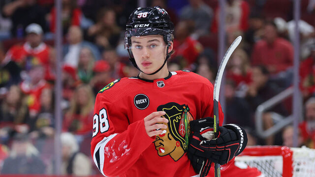 CHICAGO, ILLINOIS - SEPTEMBER 28: Connor Bedard #98 of the Chicago Blackhawks looks on against the St. Louis Blues during the first period of a preseason game at the United Center on September 28, 2023 in Chicago, Illinois.