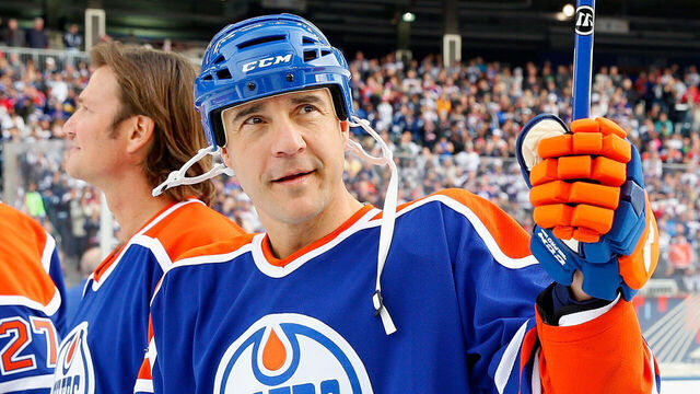 WINNIPEG, MB - OCTOBER 22: Steve Staios #24 of the Edmonton Oilers alumni waves to the crowd during team introductions for the 2016 Tim Hortons NHL Heritage Classic Alumni Game to be played against the Winnipeg Jets alumni at Investors Group Field on October 22, 2016 in Winnipeg, Canada.