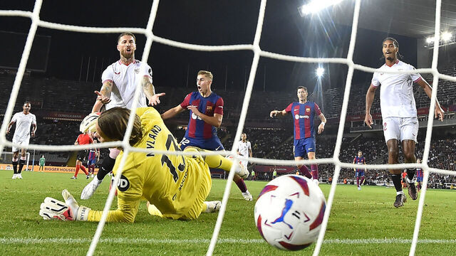 Sevilla's Spanish defender #04 Sergio Ramos (L) reacts to scoring an owngoal during the Spanish Liga football match between FC Barcelona and Sevilla FC at the Estadi Olimpic Lluis Companys in Barcelona on September 29, 2023.