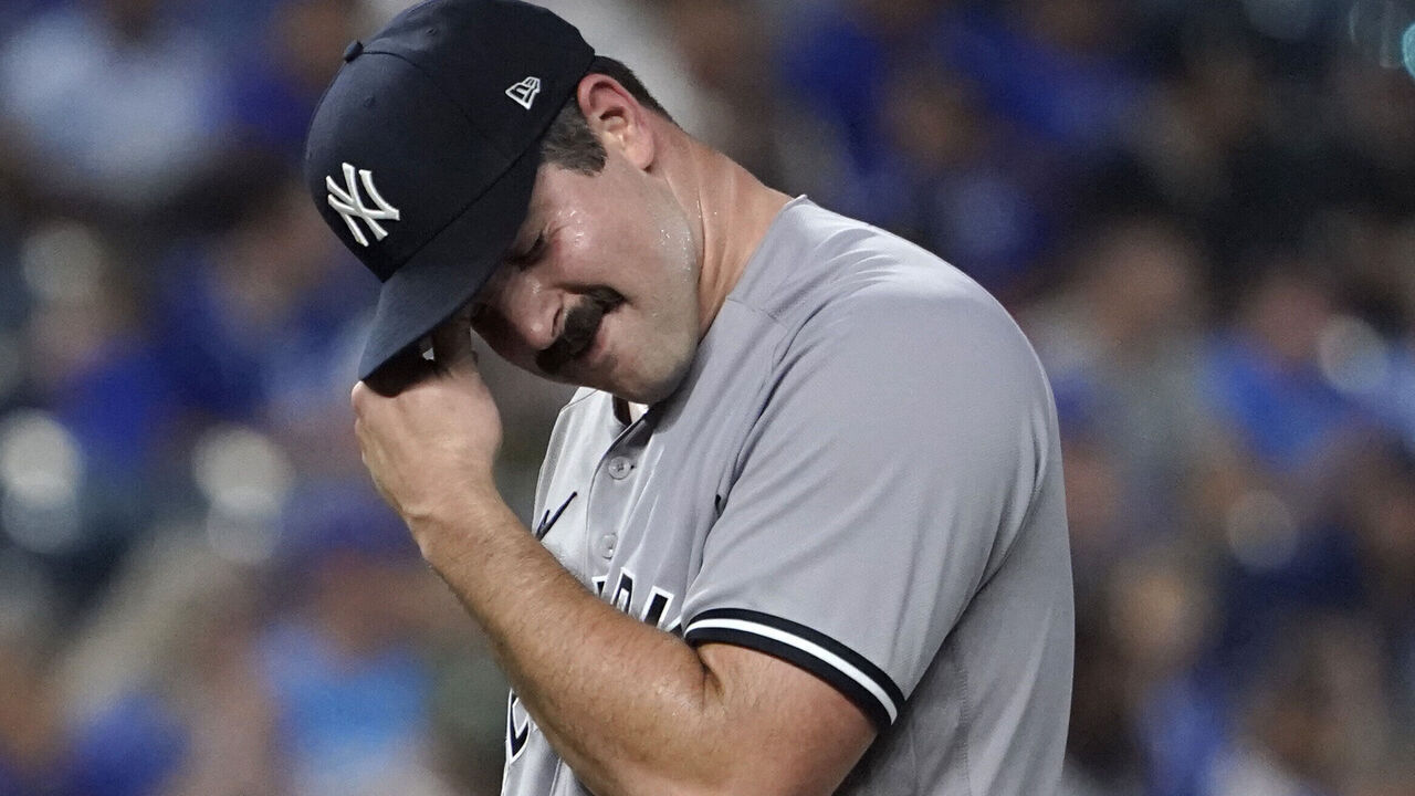 KANSAS CITY, MISSOURI - SEPTEMBER 29: Carlos Rodon #55 of the New York Yankees reacts after walking Logan Porter #88 of the Kansas City Royals in the first inning at Kauffman Stadium on September 29, 2023 in Kansas City, Missouri.
