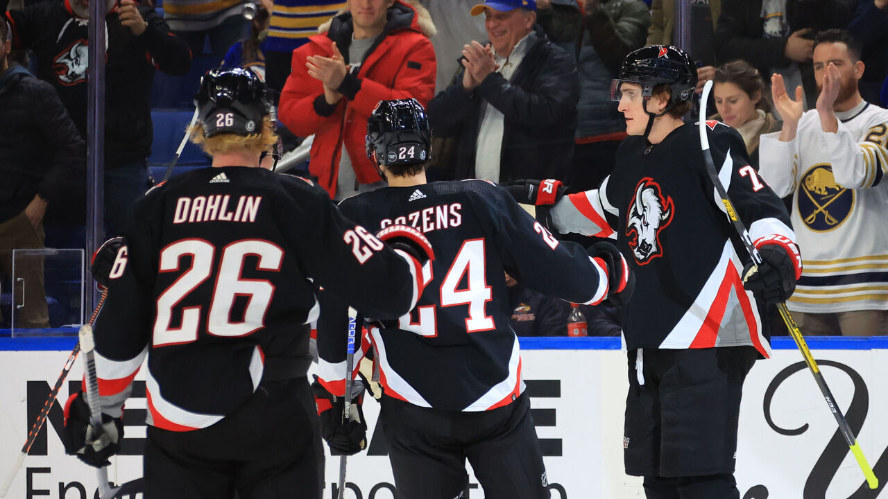 BUFFALO, NY - DECEMBER 13: Tage Thompson #72 celebrates his third period goal with Dylan Cozens #24 and Rasmus Dahlin #26 of the Buffalo Sabres during an NHL game against the Los Angeles Kings on December 13, 2022 at KeyBank Center in Buffalo, New York.