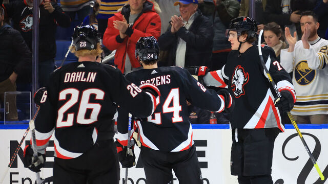 BUFFALO, NY - DECEMBER 13: Tage Thompson #72 celebrates his third period goal with Dylan Cozens #24 and Rasmus Dahlin #26 of the Buffalo Sabres during an NHL game against the Los Angeles Kings on December 13, 2022 at KeyBank Center in Buffalo, New York.