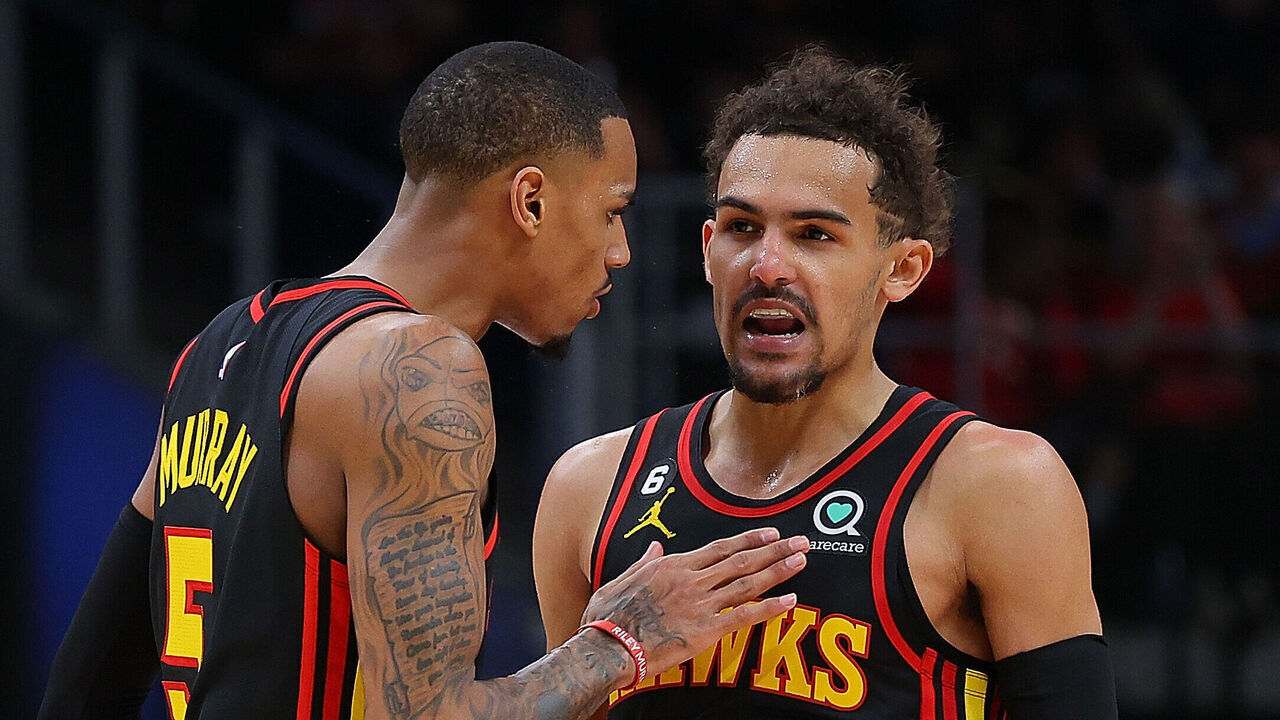 ATLANTA, GEORGIA - APRIL 21: Trae Young #11 of the Atlanta Hawks reacts after hitting a three-point basket against the Boston Celtics with Dejounte Murray #5 during the fourth quarter of Game Three of the Eastern Conference First Round Playoffs at State Farm Arena on April 21, 2023 in Atlanta, Georgia.